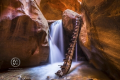 Hiking through the red rock slot canyons in Kanarraville, Utah.