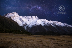 The snowy mountain peaks of the Mount Cook National Park sits under starry skies.