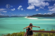 Sailing through the Whitsunday Islands to the white silica sands of Whitehaven Beach is a popular activity in Australia. A woman takes in the beautiful view.