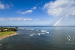 A rainbow over the Hawaiian surf.