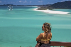 Sailing through the Whitsunday Islands to the white silica sands of Whitehaven Beach is a popular activity in Australia. A woman takes in the beautiful view.