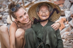 Bai Xep is a quiet remote fishing village off the tourist path, 10km from the major city of Qui Nhon. A tourist meets a local woman hard at work in the village.