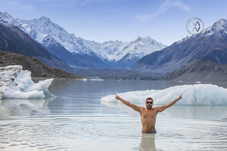 People swim in the icy glacial lakes of Mount Cook National Park.