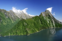 Milford Sound, New Zealand. The majestic fjords, waterfalls, and imposing mountaintops in Milford Sound national park. Mitre Peak in the background is the most famous landmark.