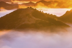 The Blue Duck lodge located in the Whanganui National park is a working cattle farm with a focus on conservation. The early morning fog floods the valley at sunrise. A group of horse trekkers ride to the summet to catch the sunrise.