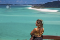 Sailing through the Whitsunday Islands to the white silica sands of Whitehaven Beach is a popular activity in Australia. A woman takes in the beautiful view.
