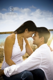 A young couple poses for portraits on the beach in Encinitas, California.