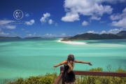 Sailing through the Whitsunday Islands to the white silica sands of Whitehaven Beach is a popular activity in Australia. A woman takes in the beautiful view.