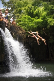 The secret local swimming hold Kipu Falls. It is a freshwate swiming hold surrounded by 20 foot walls which provide for excellent cliff diving and a enormous rope swing. This used to be a locals only location, but tourists often find the secret path leading to the swiming hold. The locals love to show off swing acrobatics for the tourists.
