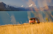 Stopping to camp alongside the enormous man-made Lake Pukaki. The distinctive emerald colour of the water is born of ice cystals in the water. Mount Cook can often be seen in the background