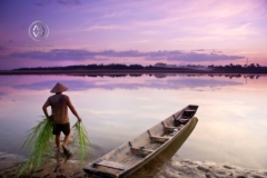 The capital city of Laos. Amazing seafood along the riverside, spectacular temples teeming with brightly clad monks, a decent nightlife and beautiful sunsets. Fishing along the river shores during susnet.