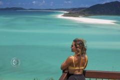 Sailing through the Whitsunday Islands to the white silica sands of Whitehaven Beach is a popular activity in Australia. A woman takes in the beautiful view.