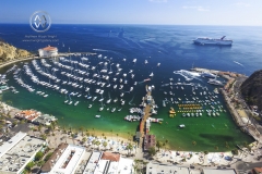 Views over California's famous island; Catalina Island. The famed Casino can be seen in the background. A cruise ship pulls into Catalina Island's, Avalon harbor.