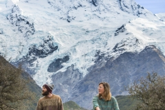 People ride bikes through the Mount Cook National Park.