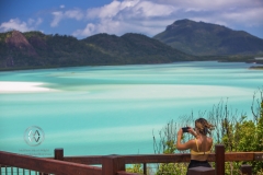 Sailing through the Whitsunday Islands to the white silica sands of Whitehaven Beach is a popular activity in Australia. A woman takes in the beautiful view.